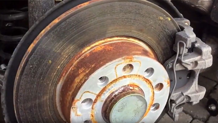 worn brake rotor - 5 Symptoms of Bad or Worn Brake Pads